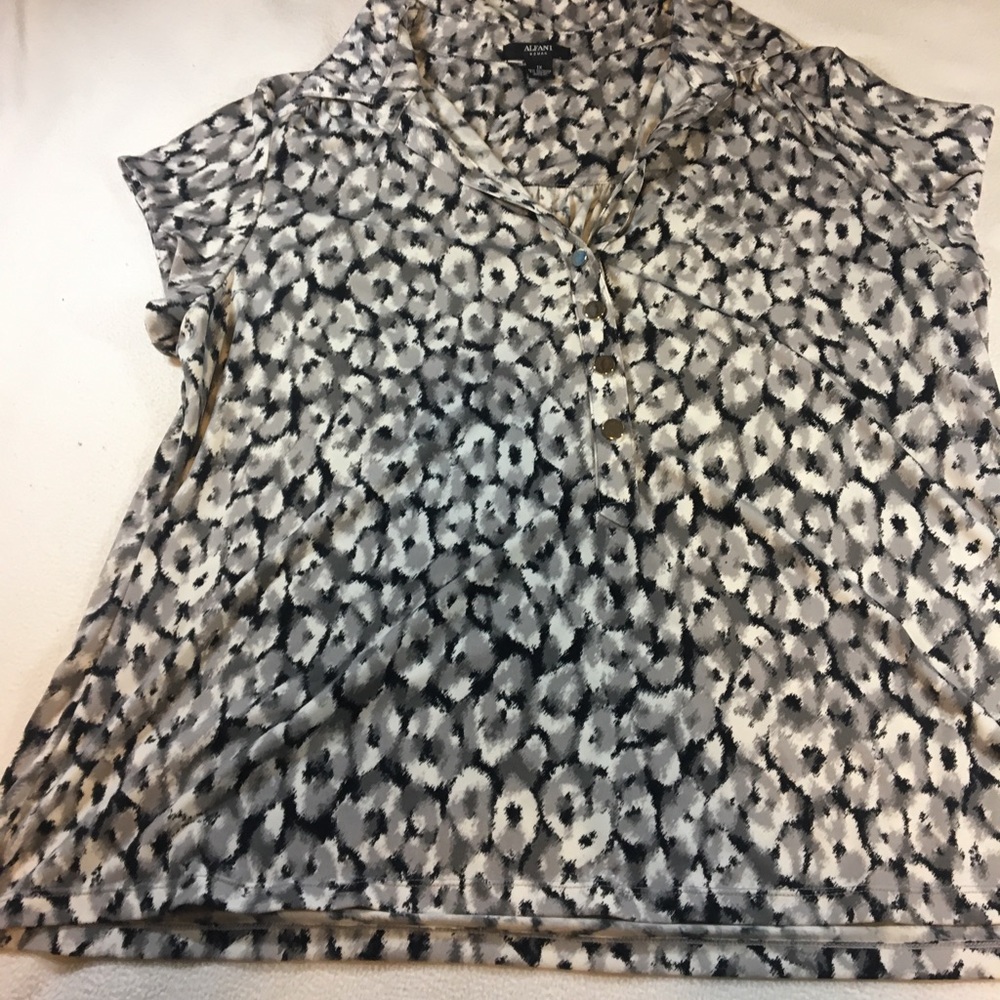 Animal print blouse with silver button accents